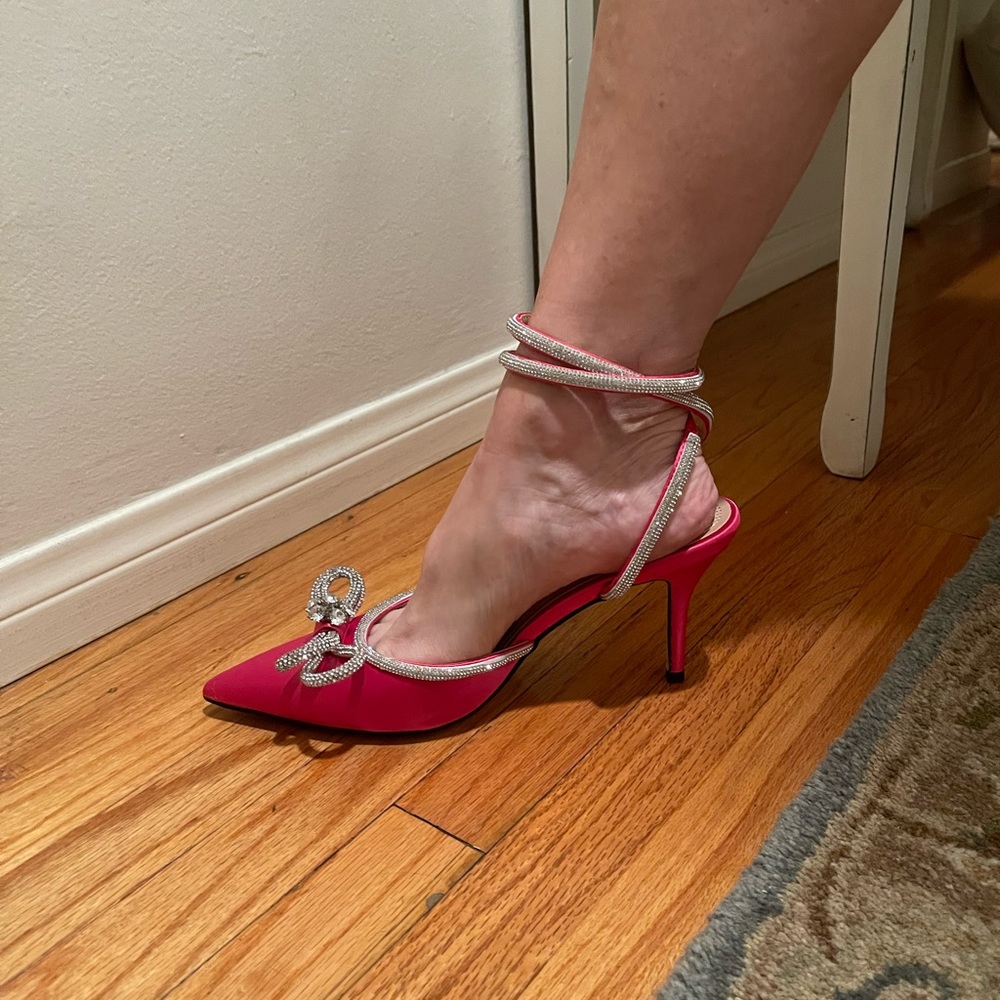 Hot pink statement pumps with ankle strap